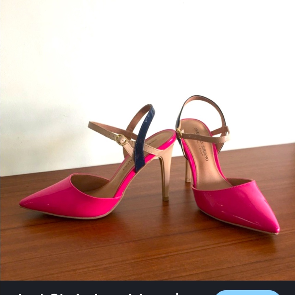 Featuring a patent PU material with a beige ankle strap and black skinny heel